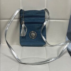 Stylish Blue and Silver Crossbody Bag with Celestial Sun emblem